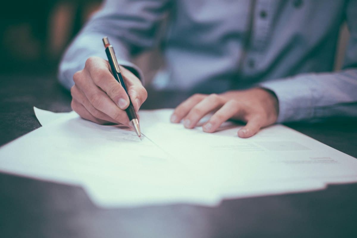 Signing aviation paperwork at a desk