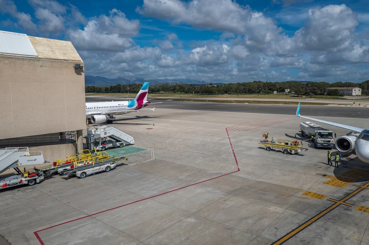 Ground crew servicing an aircraft at the gate
